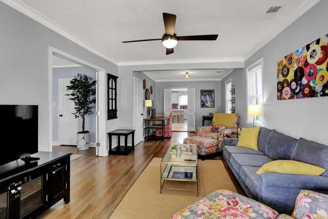 a living room with furniture and a flat screen tv
