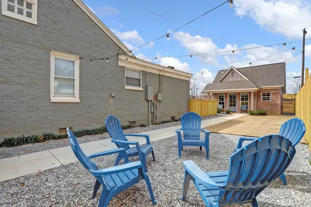 a view of a patio with furniture