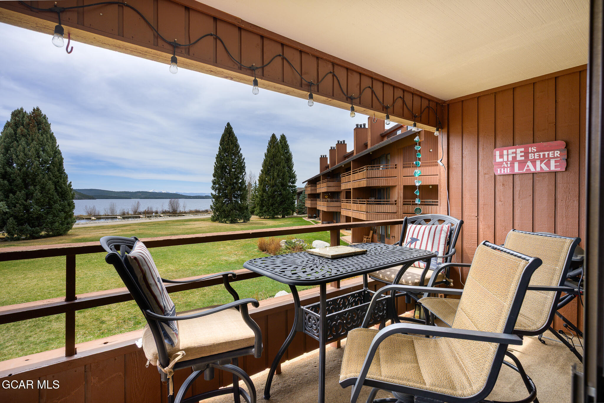 605 Lake Front Road, Unit W8 Grand Lake, CO 80447 - Photo 7 of 28 a view of a chairs and table in the balcony