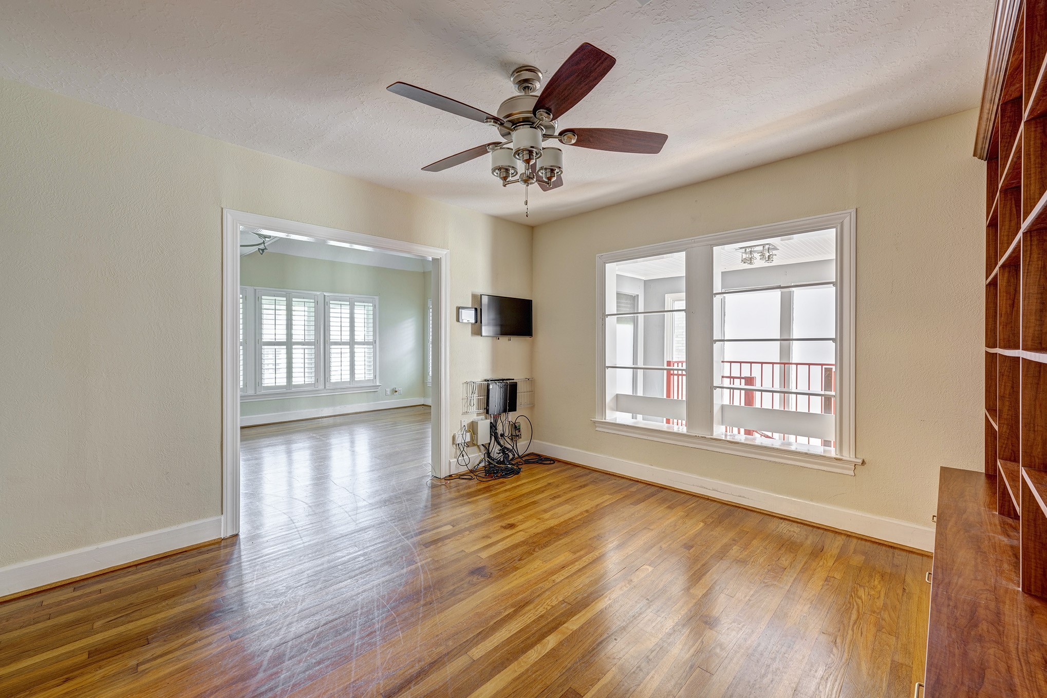 1919 West McKinney Street Houston, TX 77019 - Photo 18 of 31 a view of an empty room with window and wooden floor