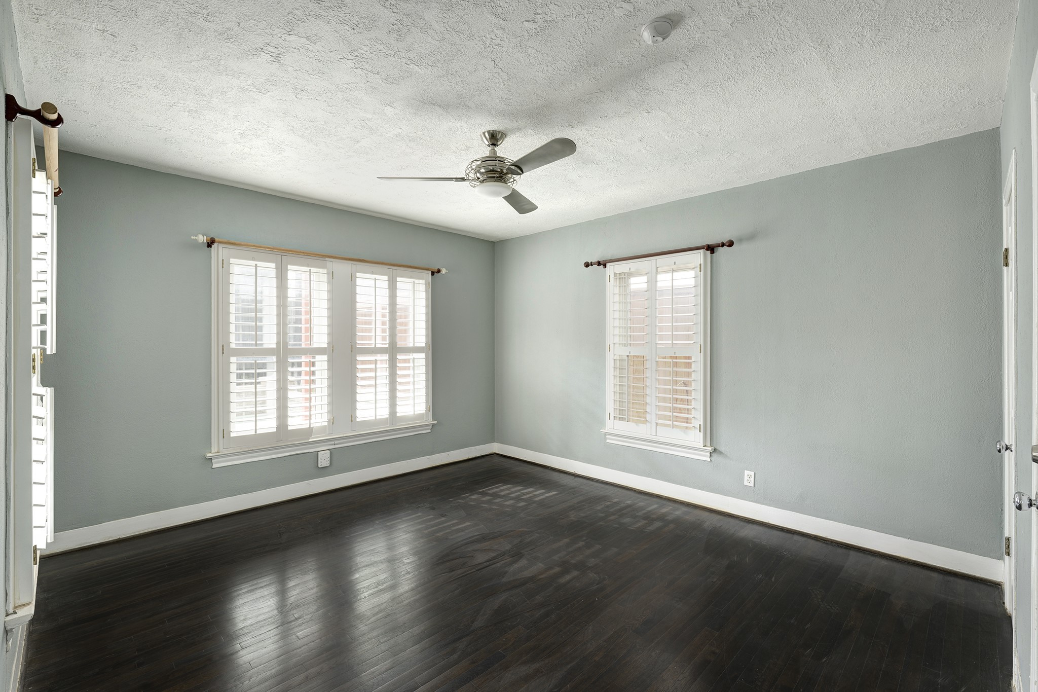 1919 West McKinney Street Houston, TX 77019 - Photo 22 of 31 a view of an empty room with wooden floor and a window