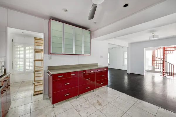 a spacious bathroom with a granite countertop sink mirror and bathtub