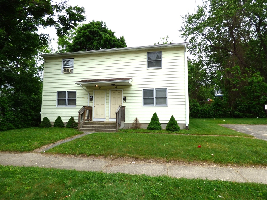 26-28 Daniel Street Springfield, MA 01151 - Photo 1 of 15 a front view of a house with a yard