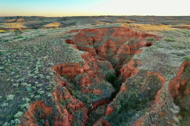 an aerial view of residential building and ocean view