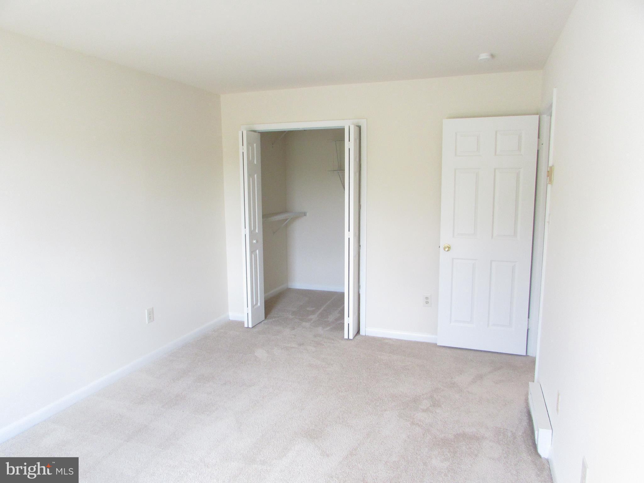 83 Trevanion Road Taneytown, MD 21787 - Photo 14 of 28 a view of an empty room and closet in it