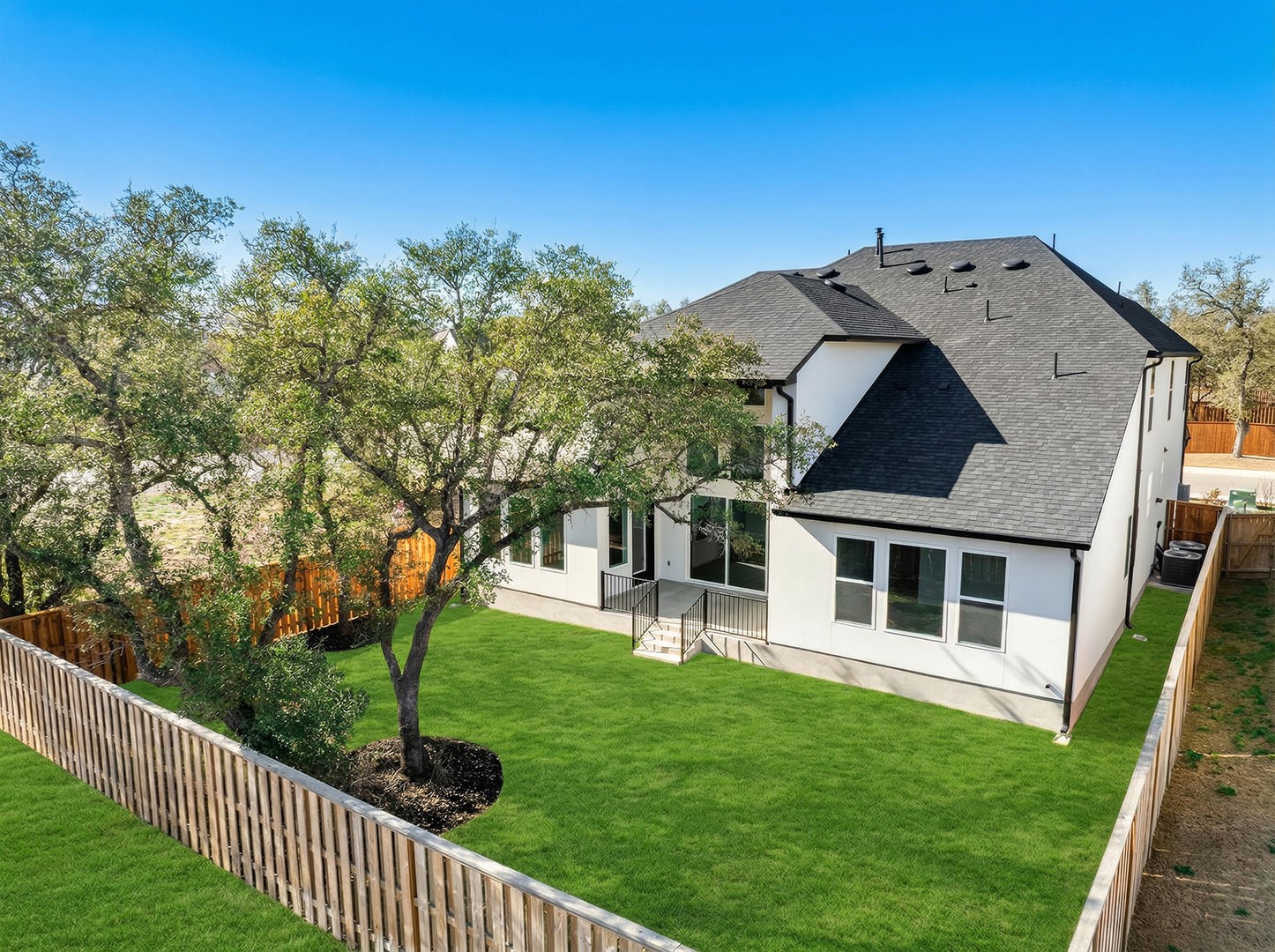 304 Barnstorm Lane Georgetown, TX 78633 - Photo 23 of 40 a view of a house with a small yard and a large tree