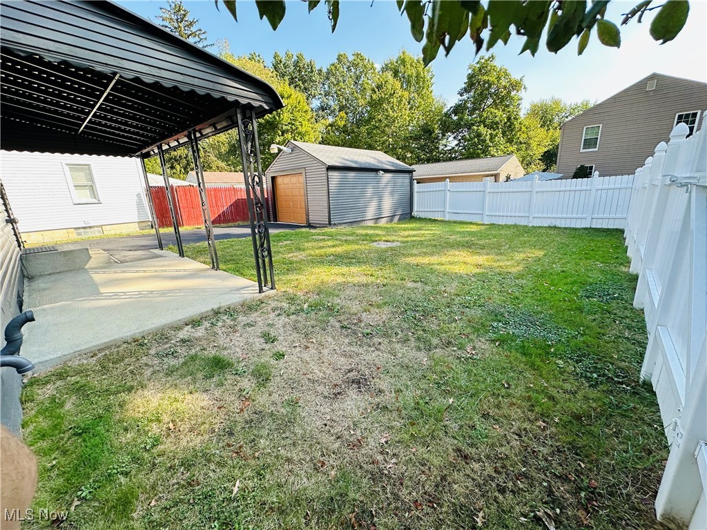 3727 Hopkins Road Youngstown, OH 44511 - Photo 18 of 40 View of yard featuring a shed and a patio area
