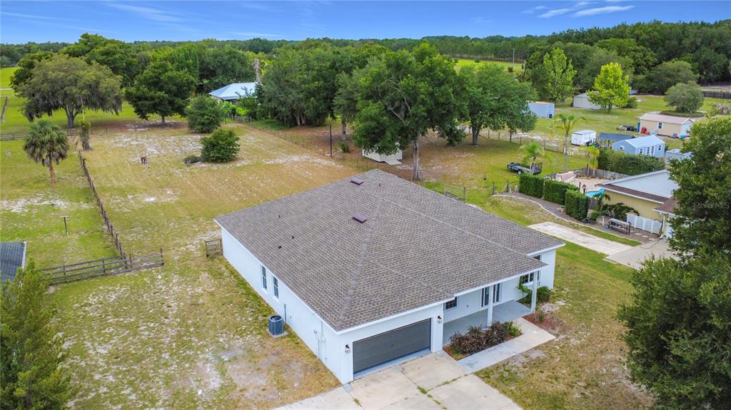 28549 Shirley Shores Road Tavares, FL 32778 - Photo 4 of 65 a aerial view of a house with pool lake view and mountain view