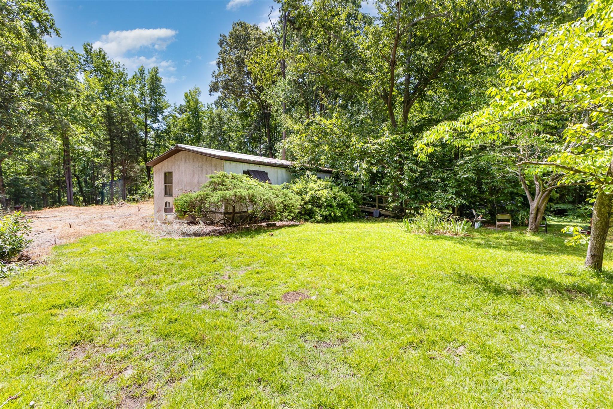 3344 Shiloh Church Road Davidson, NC 28036 - Photo 12 of 15 a backyard of a house with yard and outdoor seating
