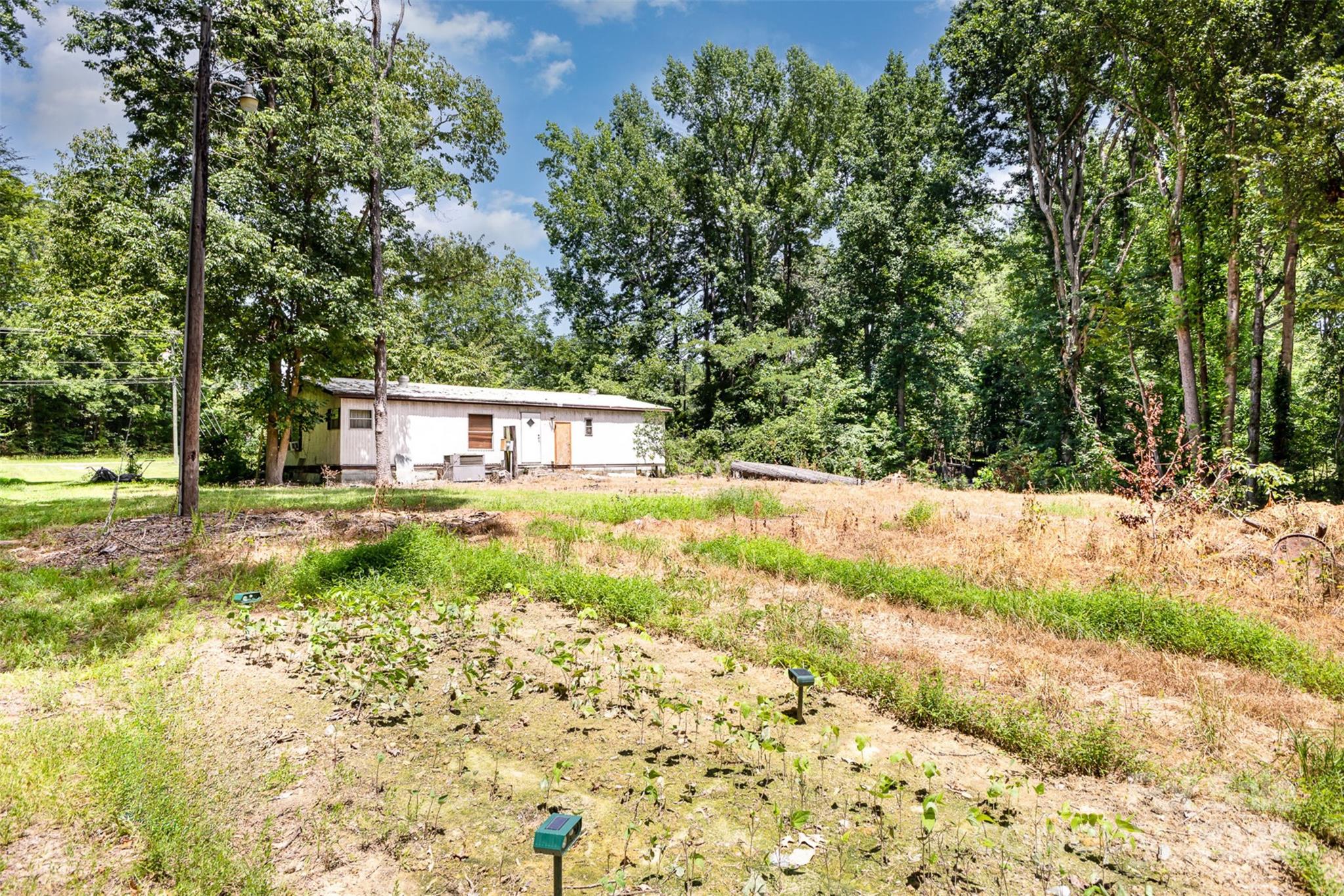 3344 Shiloh Church Road Davidson, NC 28036 - Photo 13 of 15 a view of a yard with plants and trees