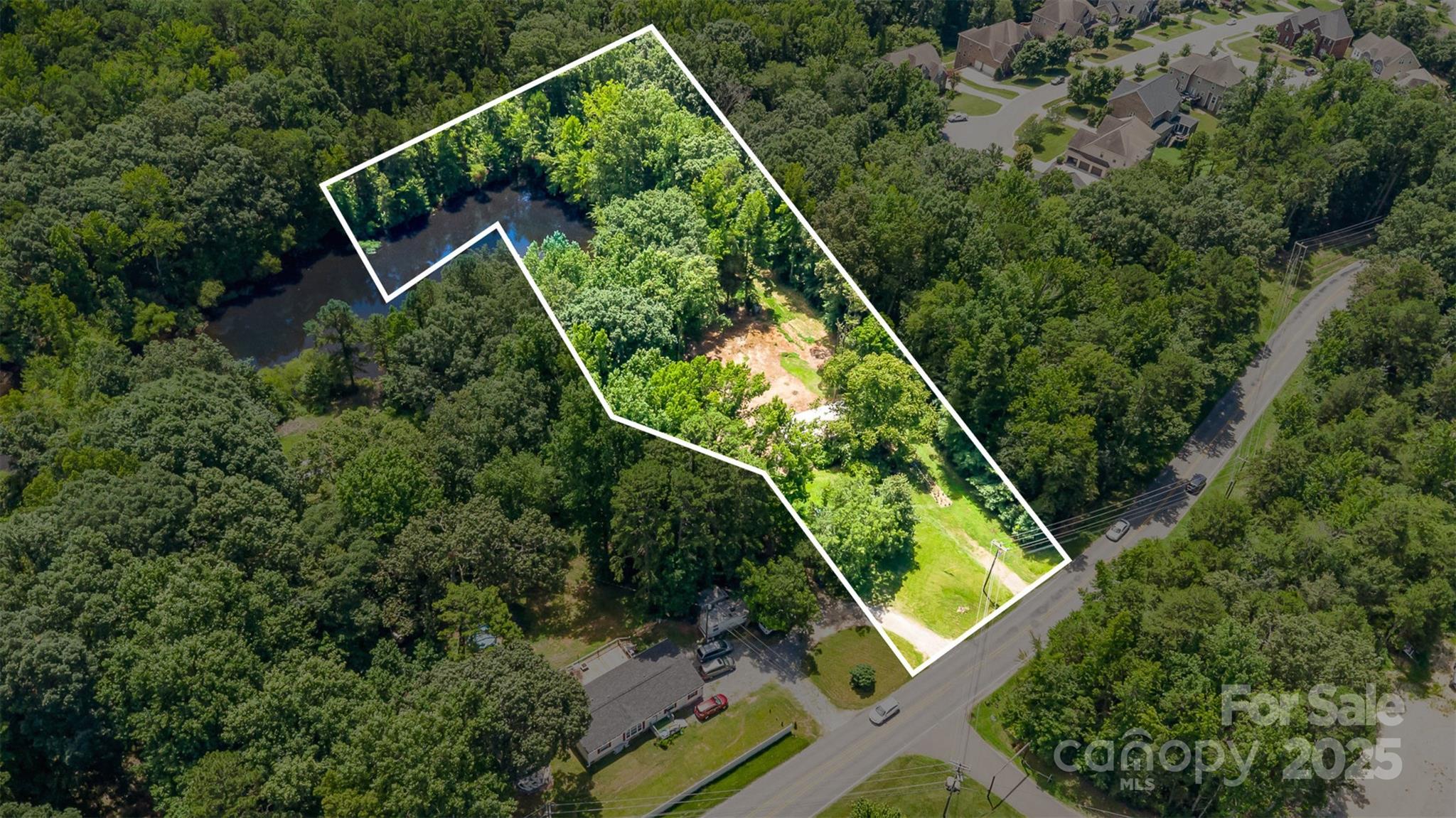 3344 Shiloh Church Road Davidson, NC 28036 - Photo 15 of 15 an aerial view of a house with a garden and deck