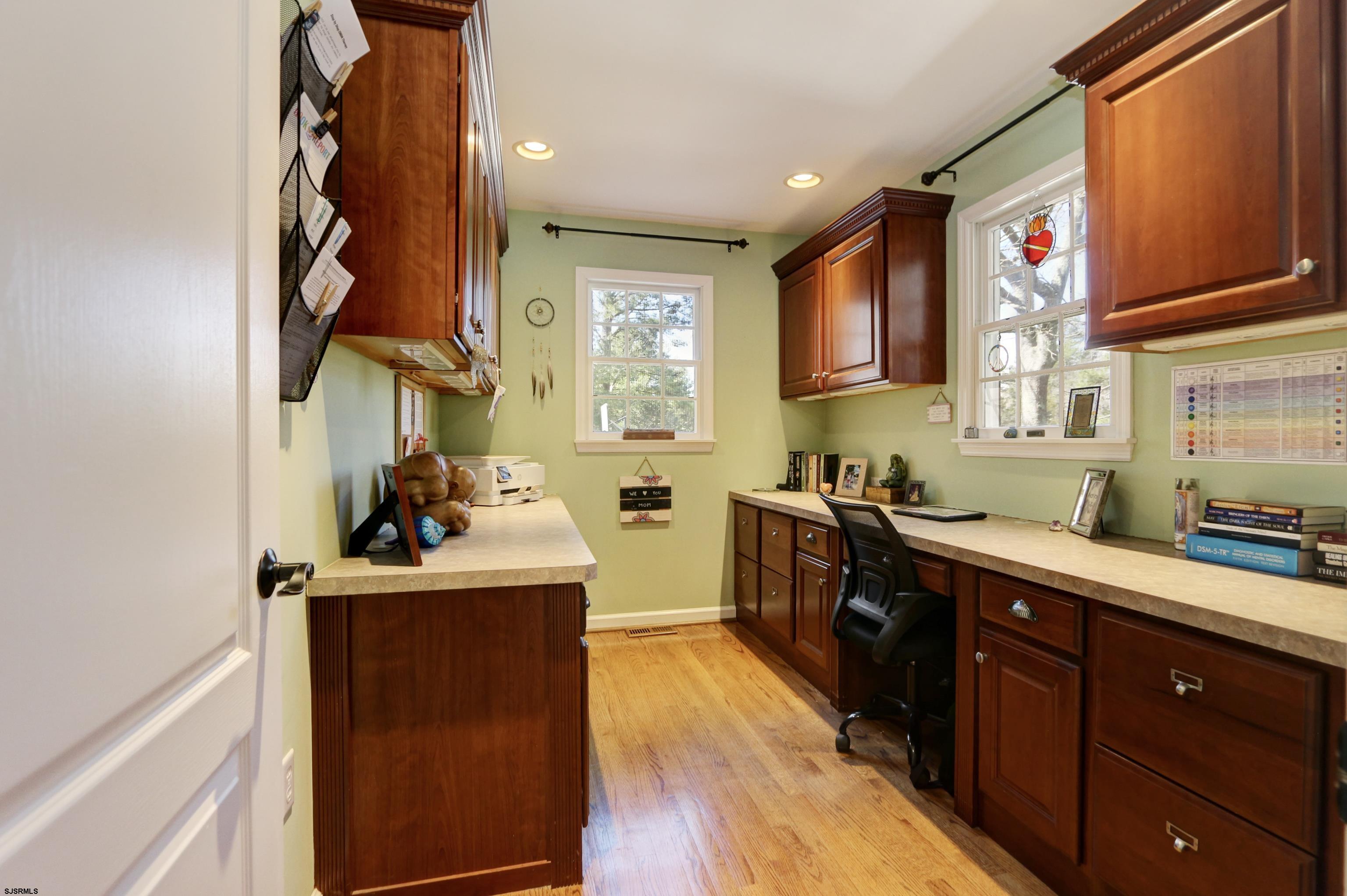 1322 Shore Road Palermo, NJ 08230 - Photo 12 of 56 a kitchen with stainless steel appliances granite countertop a sink stove and wooden cabinets