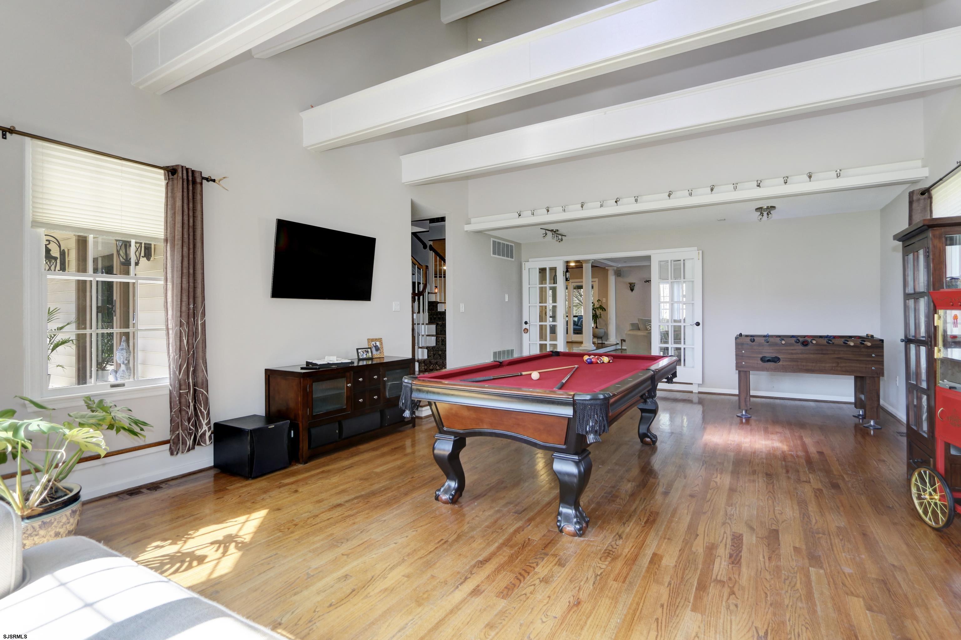 1322 Shore Road Palermo, NJ 08230 - Photo 15 of 56 a living room with furniture pool table wooden floor and a window