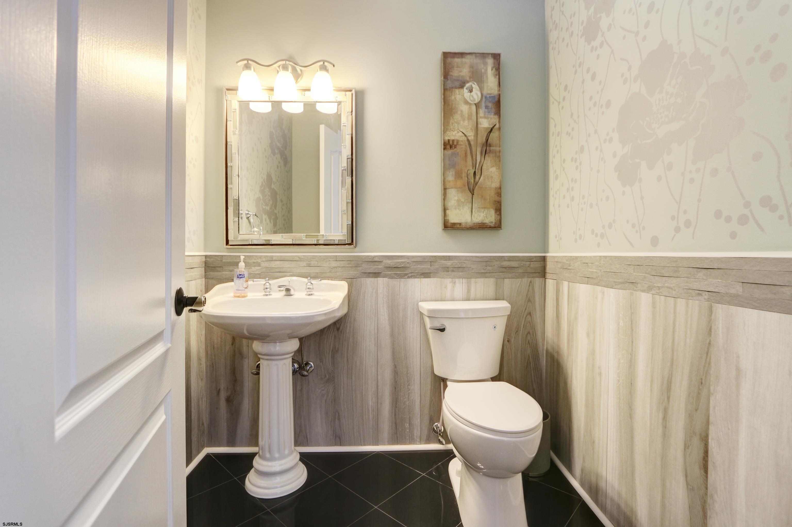 1322 Shore Road Palermo, NJ 08230 - Photo 16 of 56 a bathroom with a toilet sink and mirror