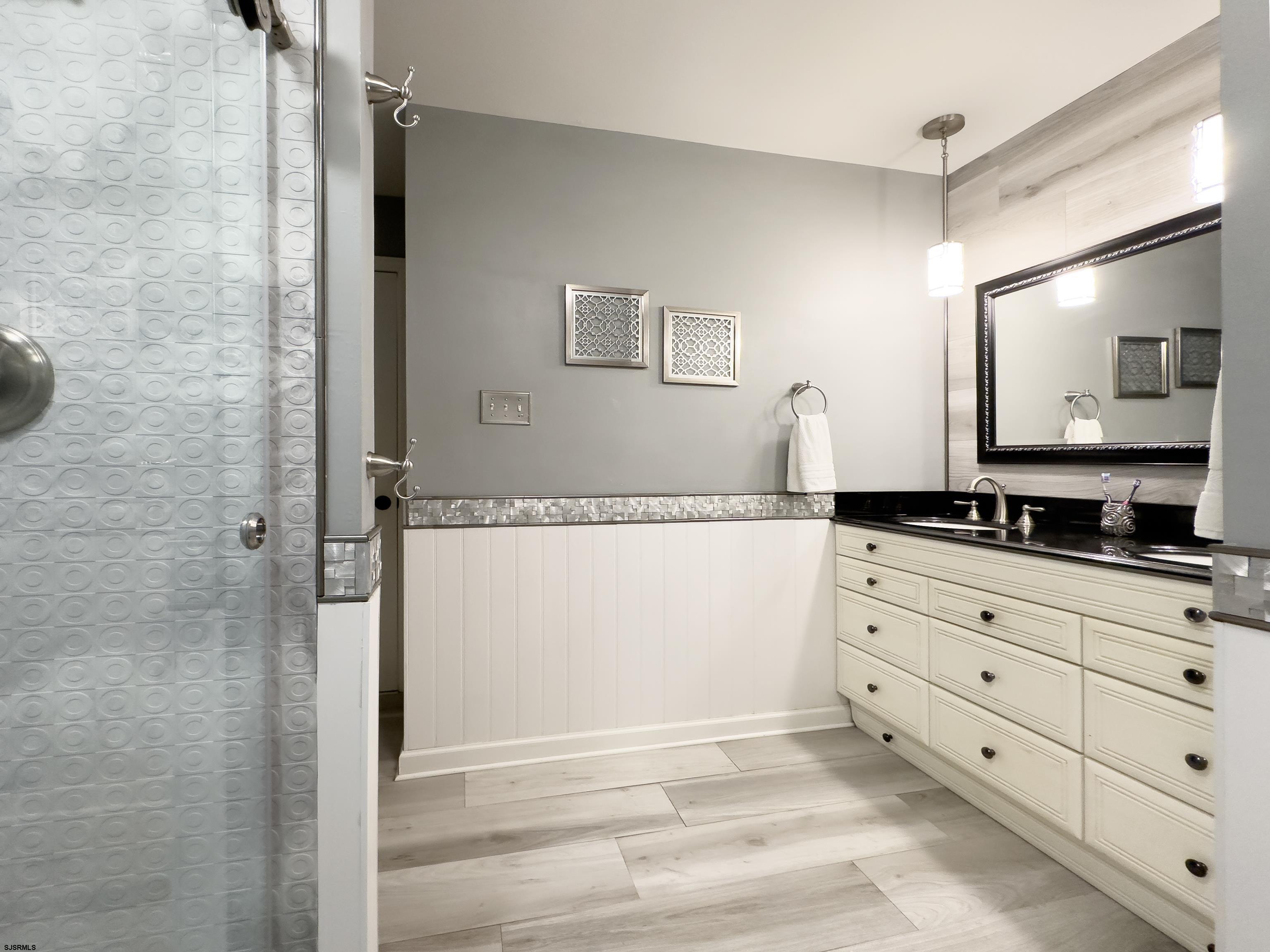 1322 Shore Road Palermo, NJ 08230 - Photo 24 of 56 a bathroom with a granite countertop sink and a mirror