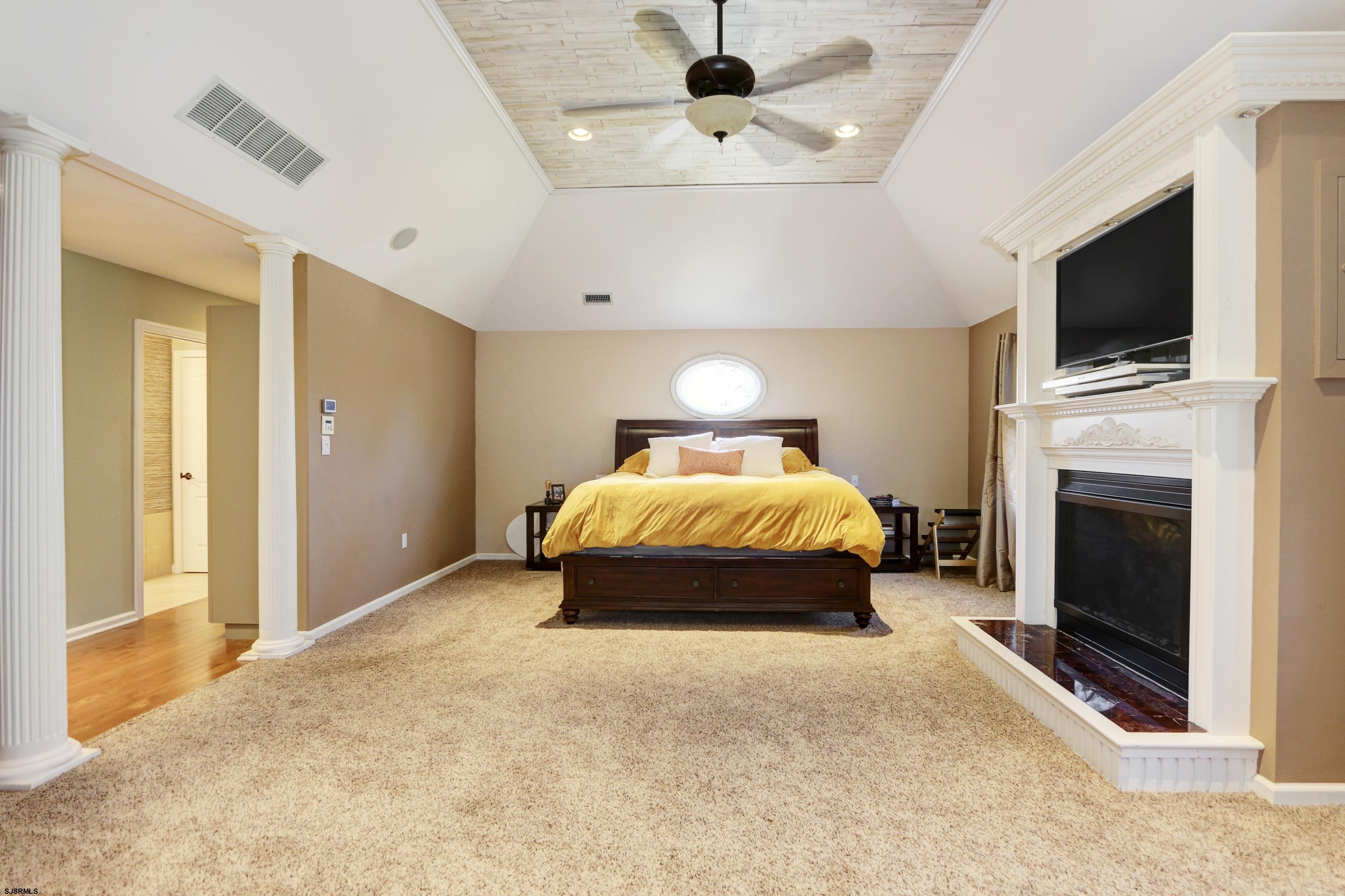 1322 Shore Road Palermo, NJ 08230 - Photo 26 of 56 a bedroom with a bed and a flat screen tv