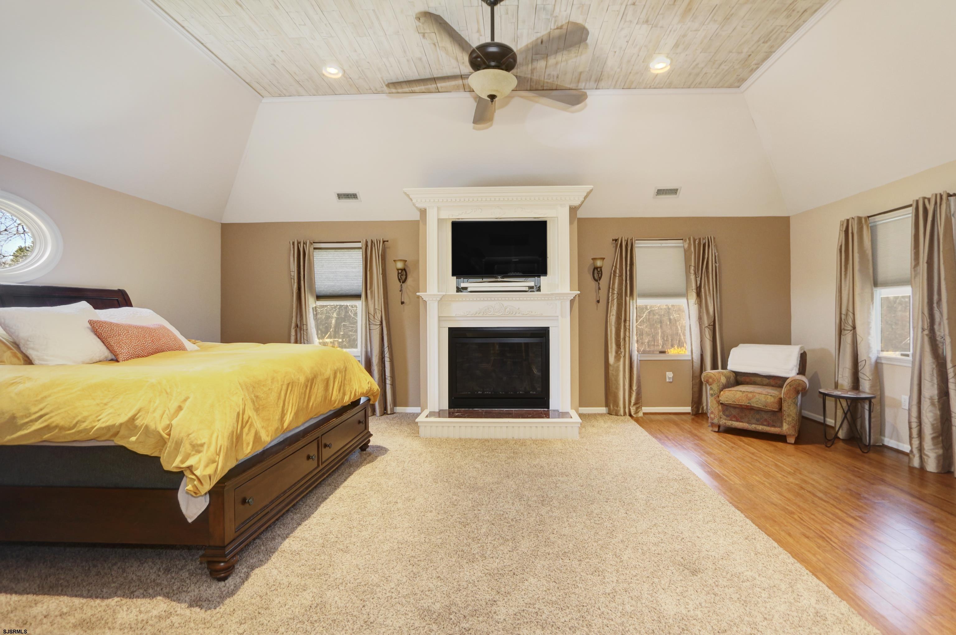 1322 Shore Road Palermo, NJ 08230 - Photo 27 of 56 a spacious bedroom with a bed and a flat screen tv