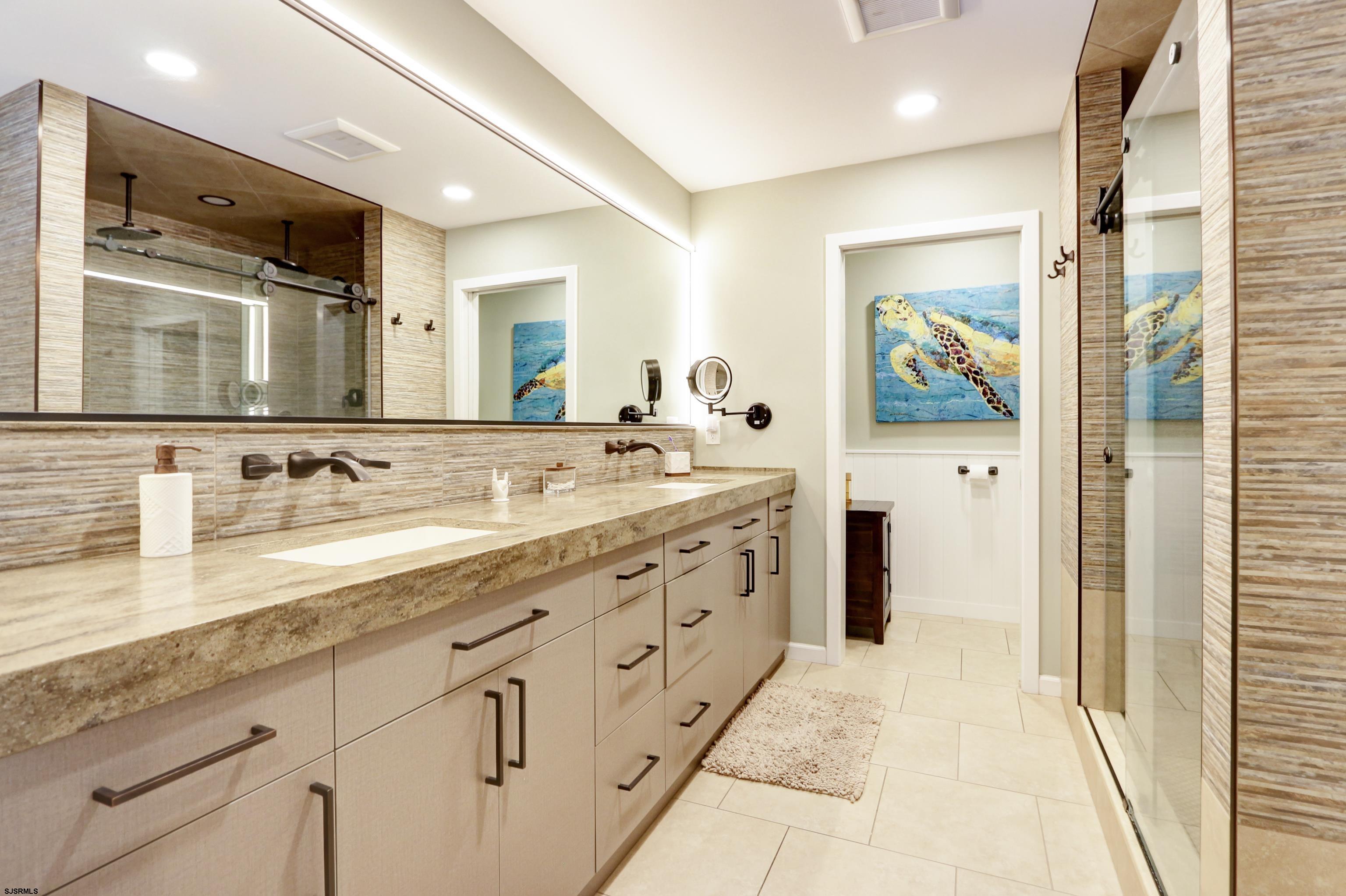 1322 Shore Road Palermo, NJ 08230 - Photo 28 of 56 a spacious bathroom with double sink and a mirror