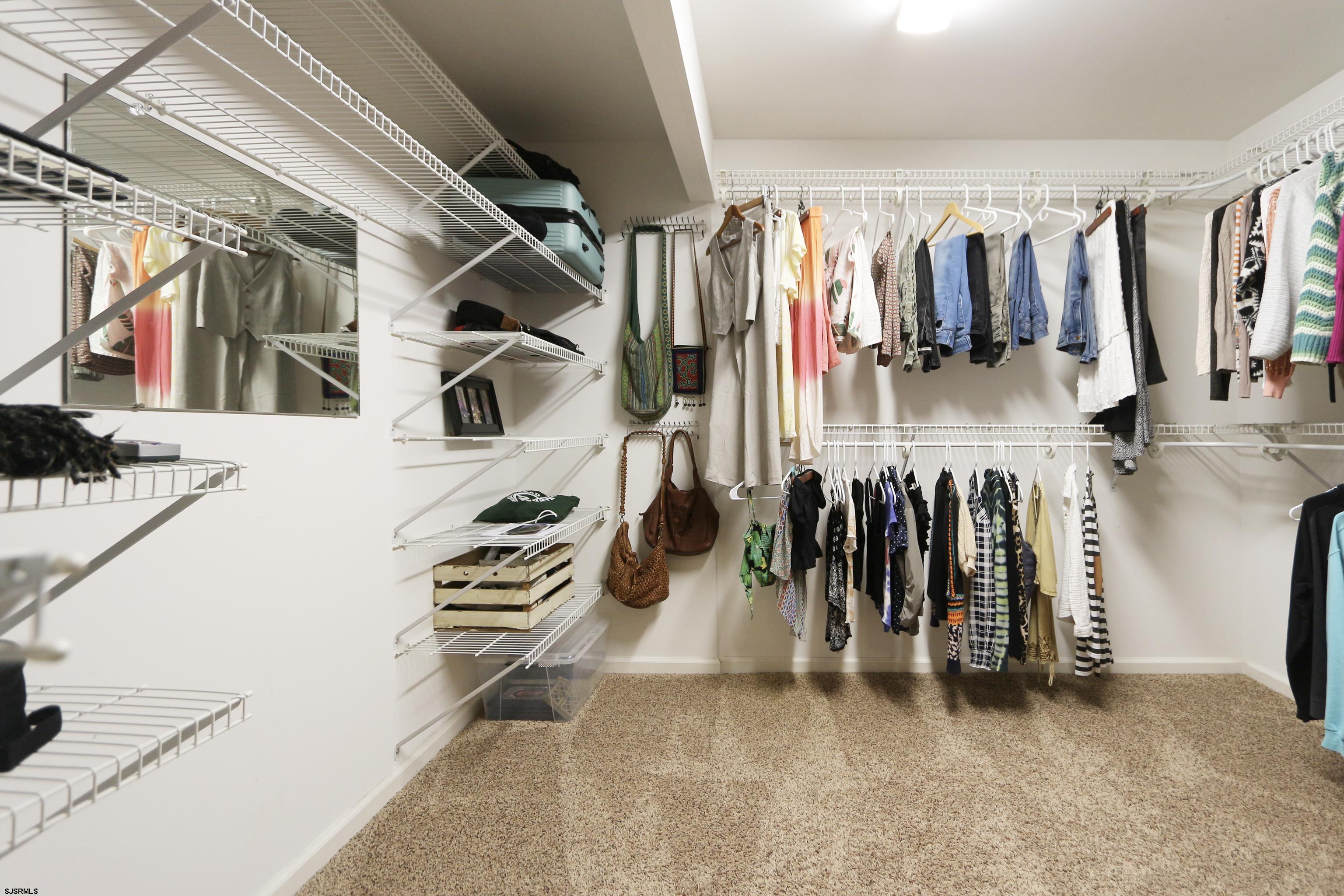 1322 Shore Road Palermo, NJ 08230 - Photo 29 of 56 a view of walk in closet with clothes and shoes