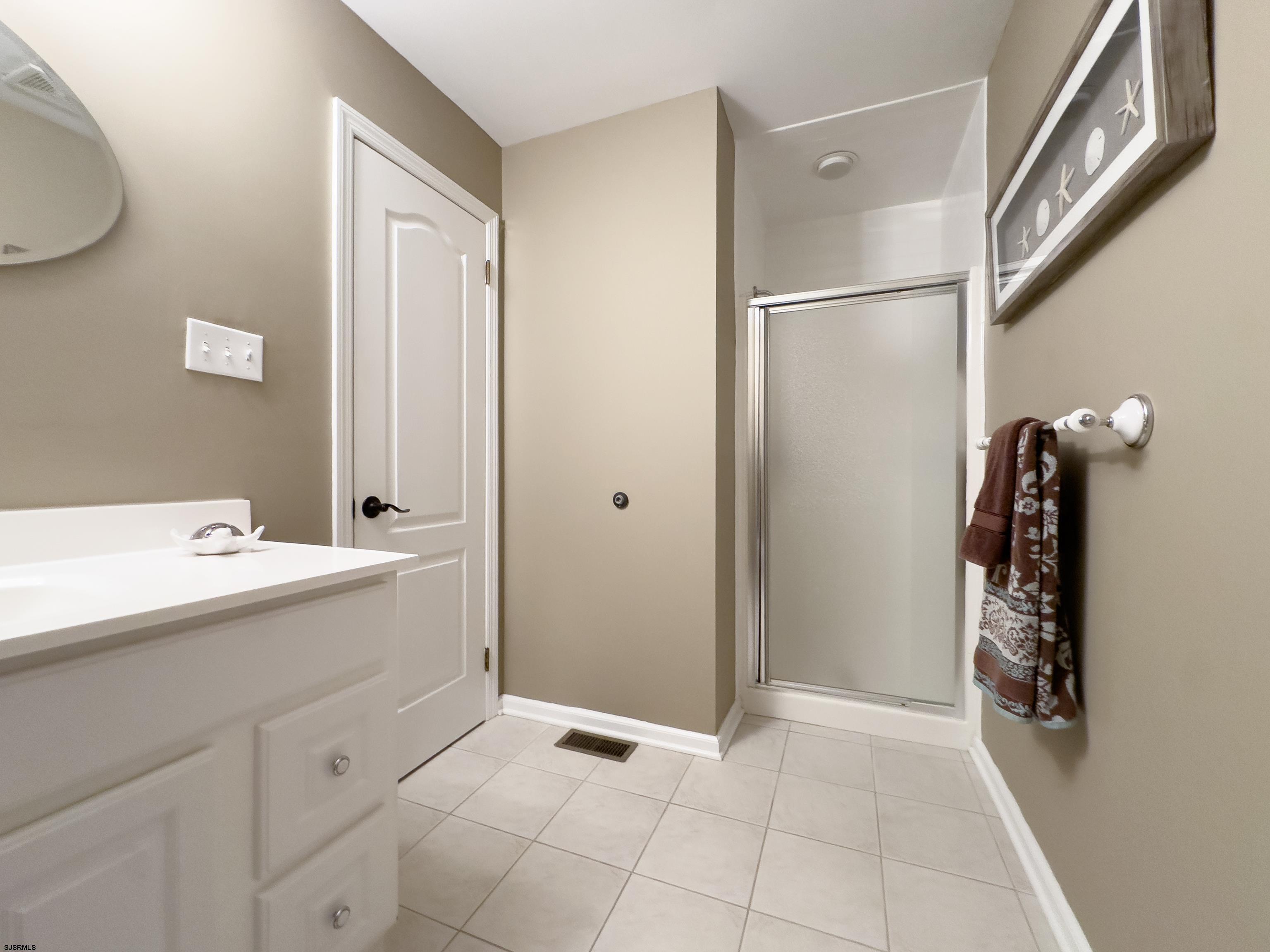1322 Shore Road Palermo, NJ 08230 - Photo 32 of 56 a view of a kitchen with a sink and a refrigerator