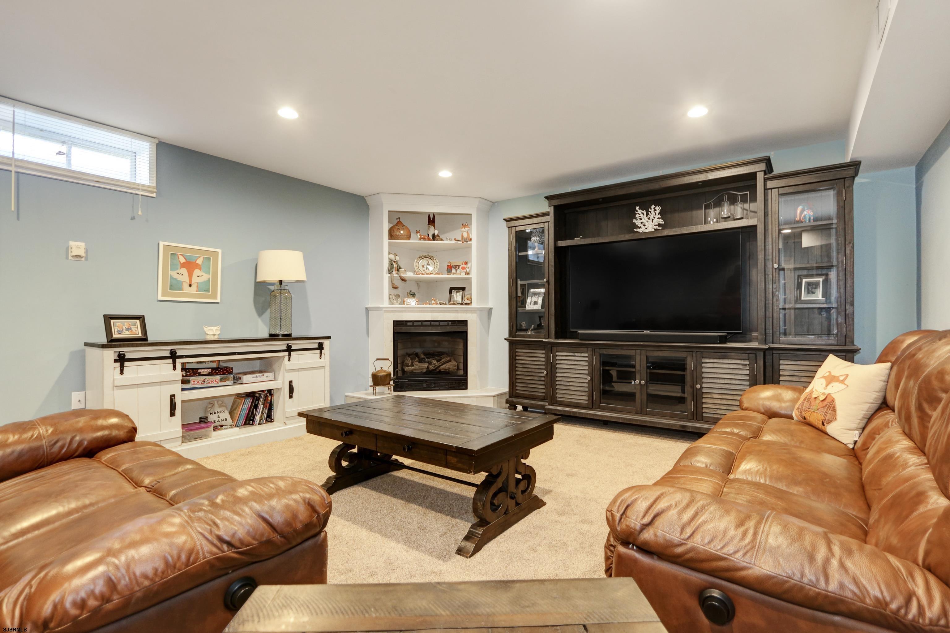 1322 Shore Road Palermo, NJ 08230 - Photo 35 of 56 a living room with furniture and a flat screen tv
