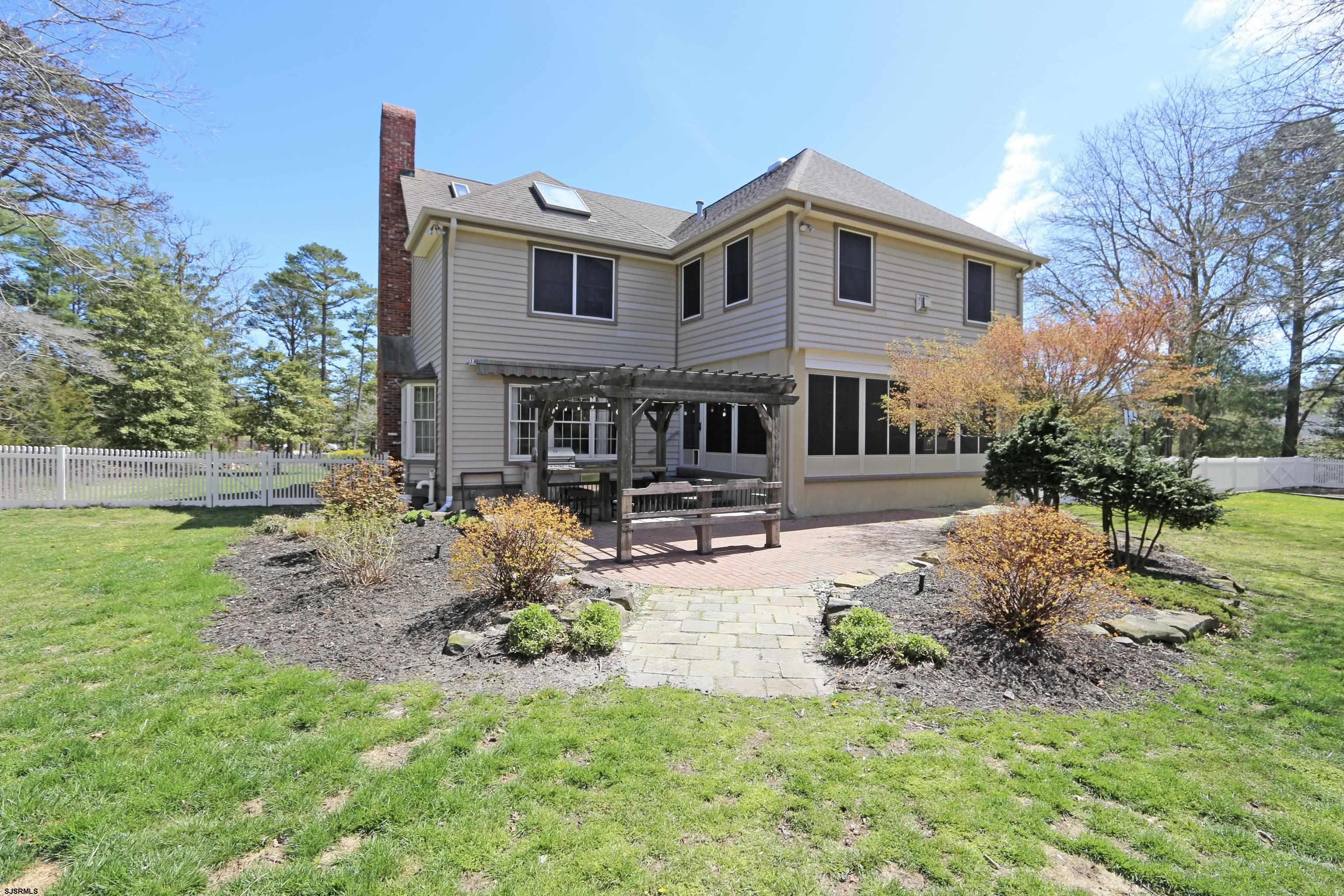 1322 Shore Road Palermo, NJ 08230 - Photo 40 of 56 a front view of a house with garden and porch