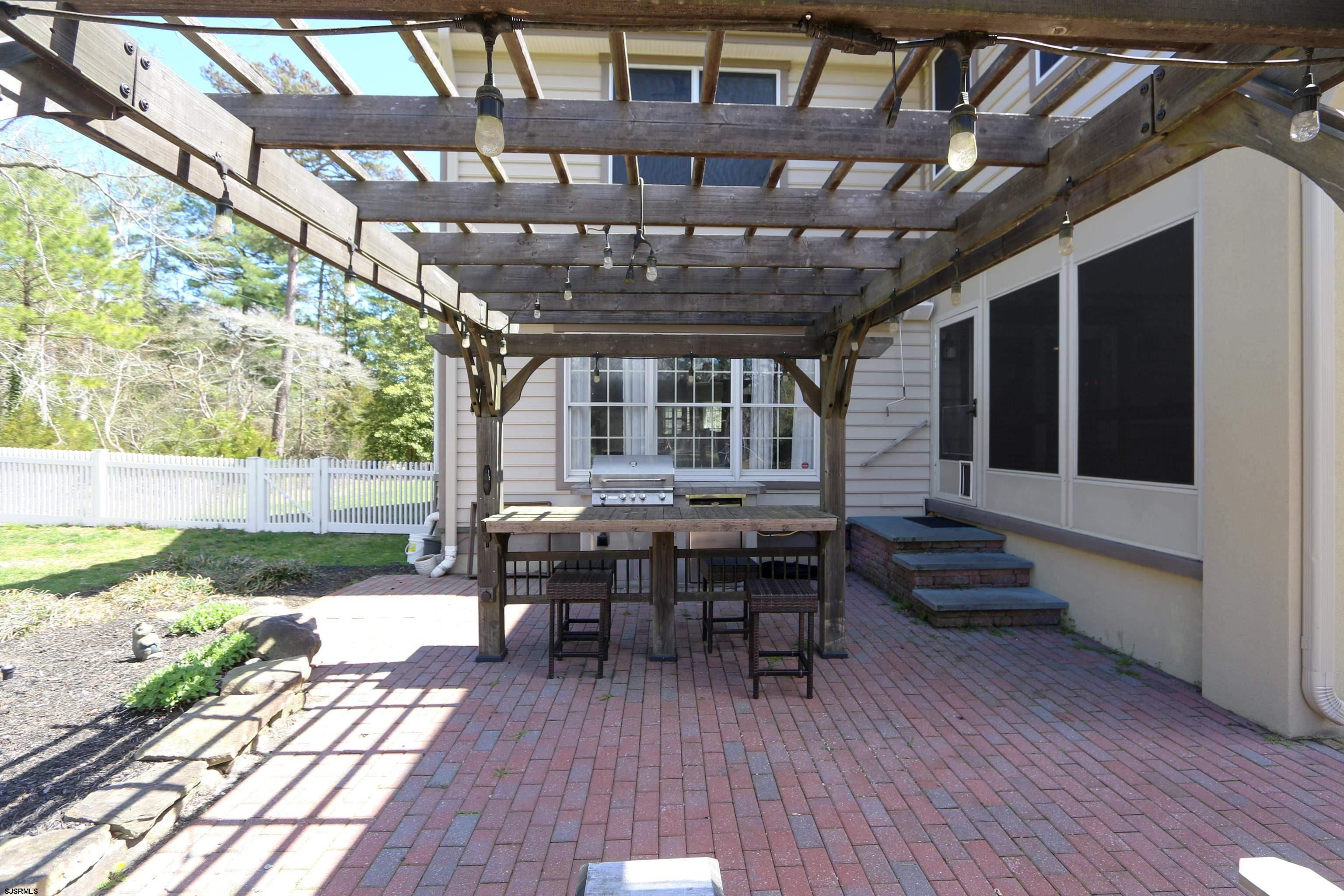 1322 Shore Road Palermo, NJ 08230 - Photo 42 of 56 a view of a porch with chairs and potted plants