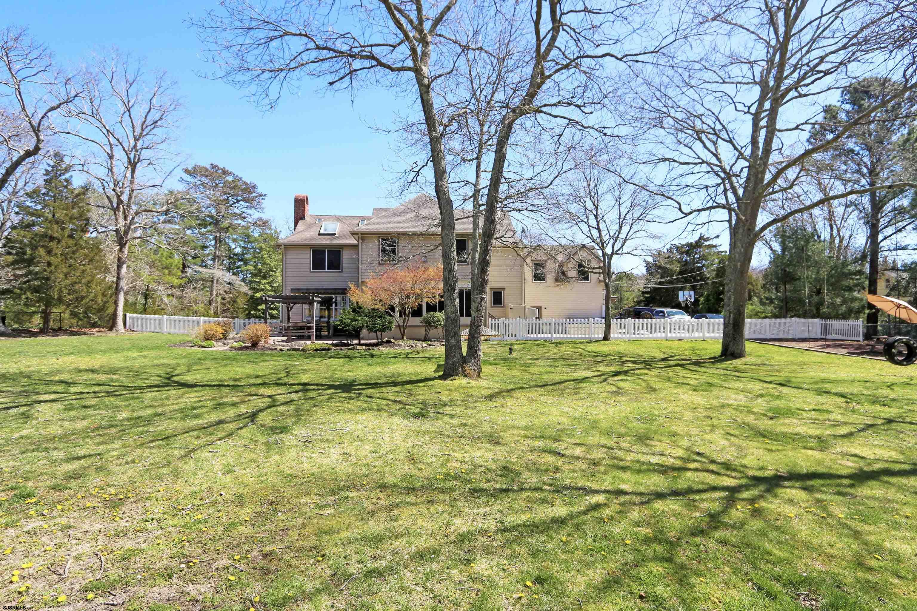 1322 Shore Road Palermo, NJ 08230 - Photo 44 of 56 a view of a house with a big yard and large trees