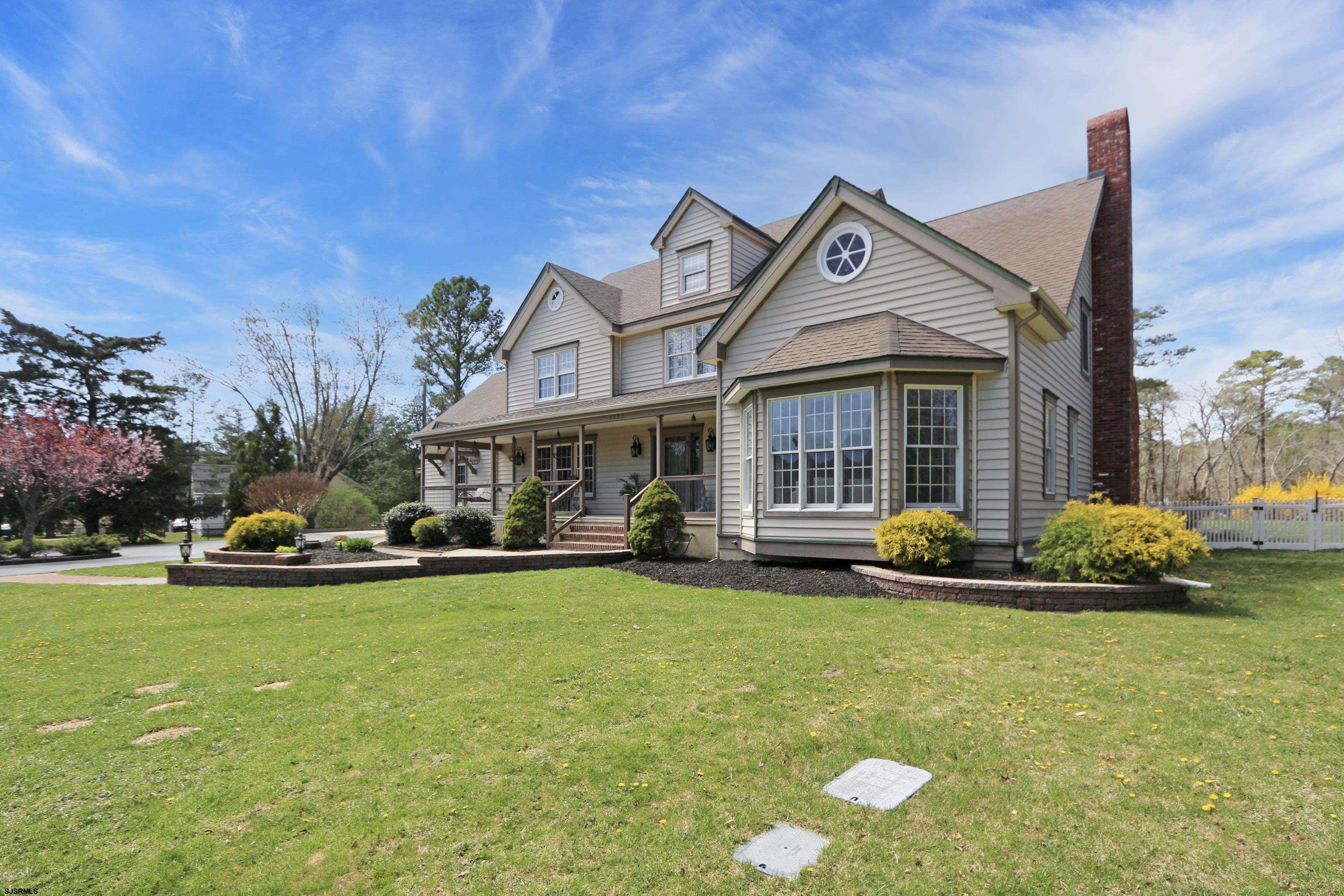 1322 Shore Road Palermo, NJ 08230 - Photo 55 of 56 a view of a house with a big yard and large trees