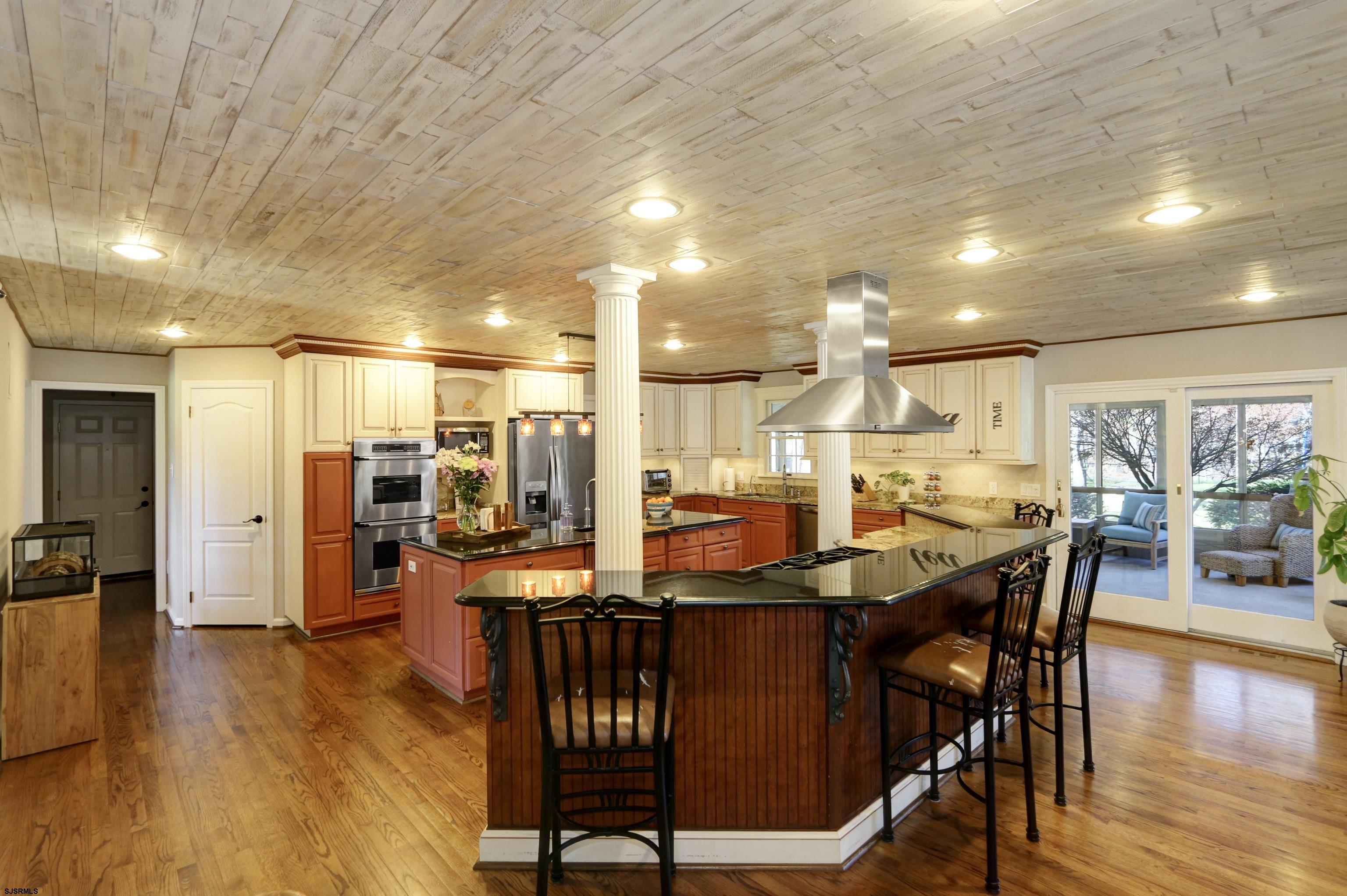 1322 Shore Road Palermo, NJ 08230 - Photo 10 of 56 a dining hall with stainless steel appliances a dining table chairs and couches