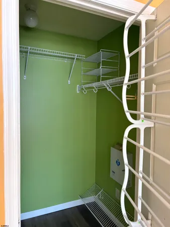 a room with wooden floors and a fan