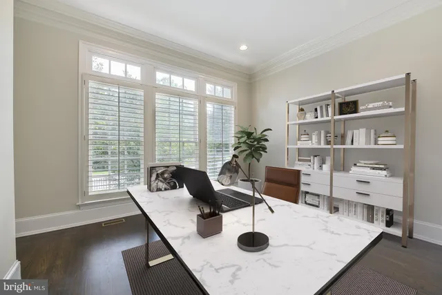 a living room with furniture and view of kitchen