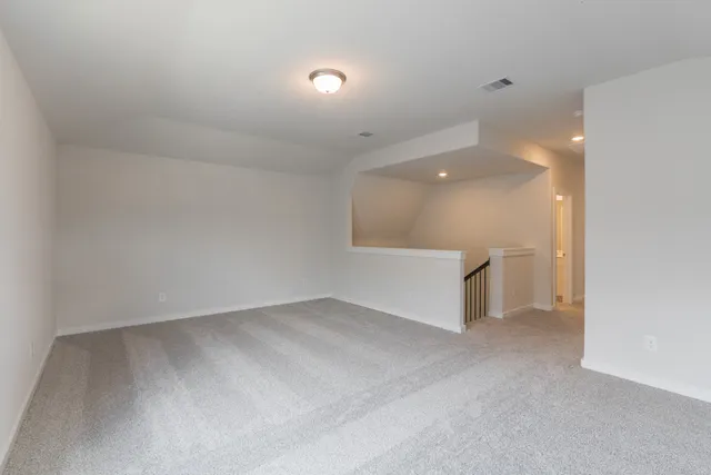 a view of an entryway with wooden floor and stairs