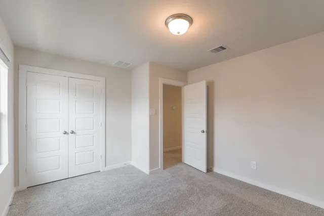 a view of a hallway with closet area