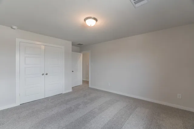 a bathroom with a bathtub shower sink vanity mirror and toilet