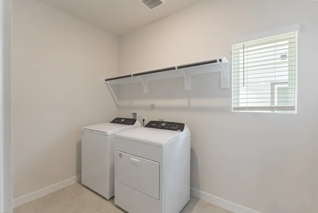 a view of an empty room and a window