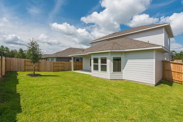 a view of backyard with green space