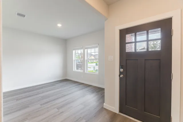 a view of gallery with wooden floor
