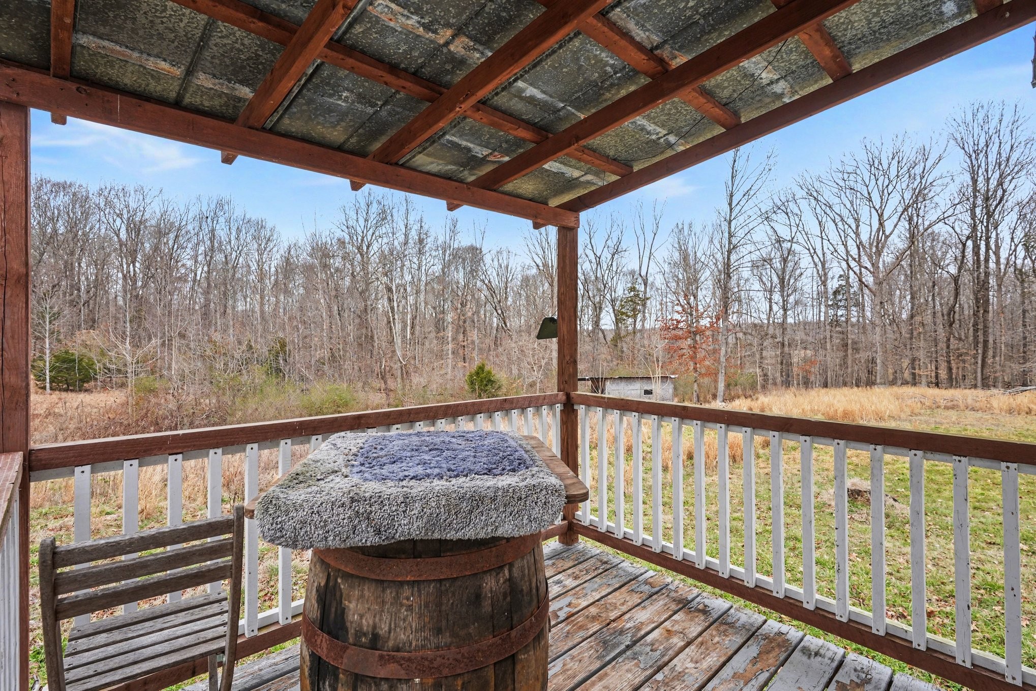 1323 Old Stage Road Charlotte, TN 37036 - Photo 12 of 25 a view of a porch with a table and chairs