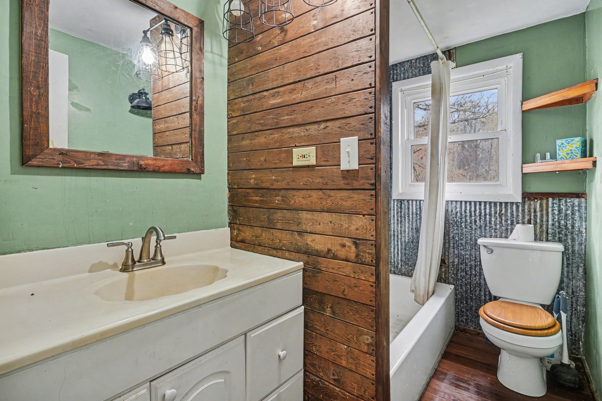 1323 Old Stage Road Charlotte, TN 37036 - Photo 13 of 25 a bathroom with a toilet sink and mirror