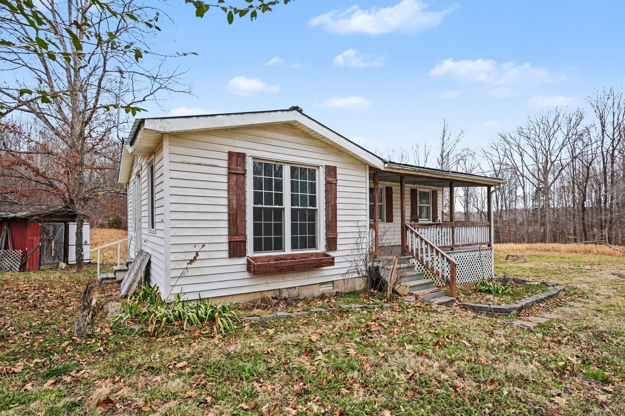 1323 Old Stage Road Charlotte, TN 37036 - Photo 2 of 25 a front view of a house with garden