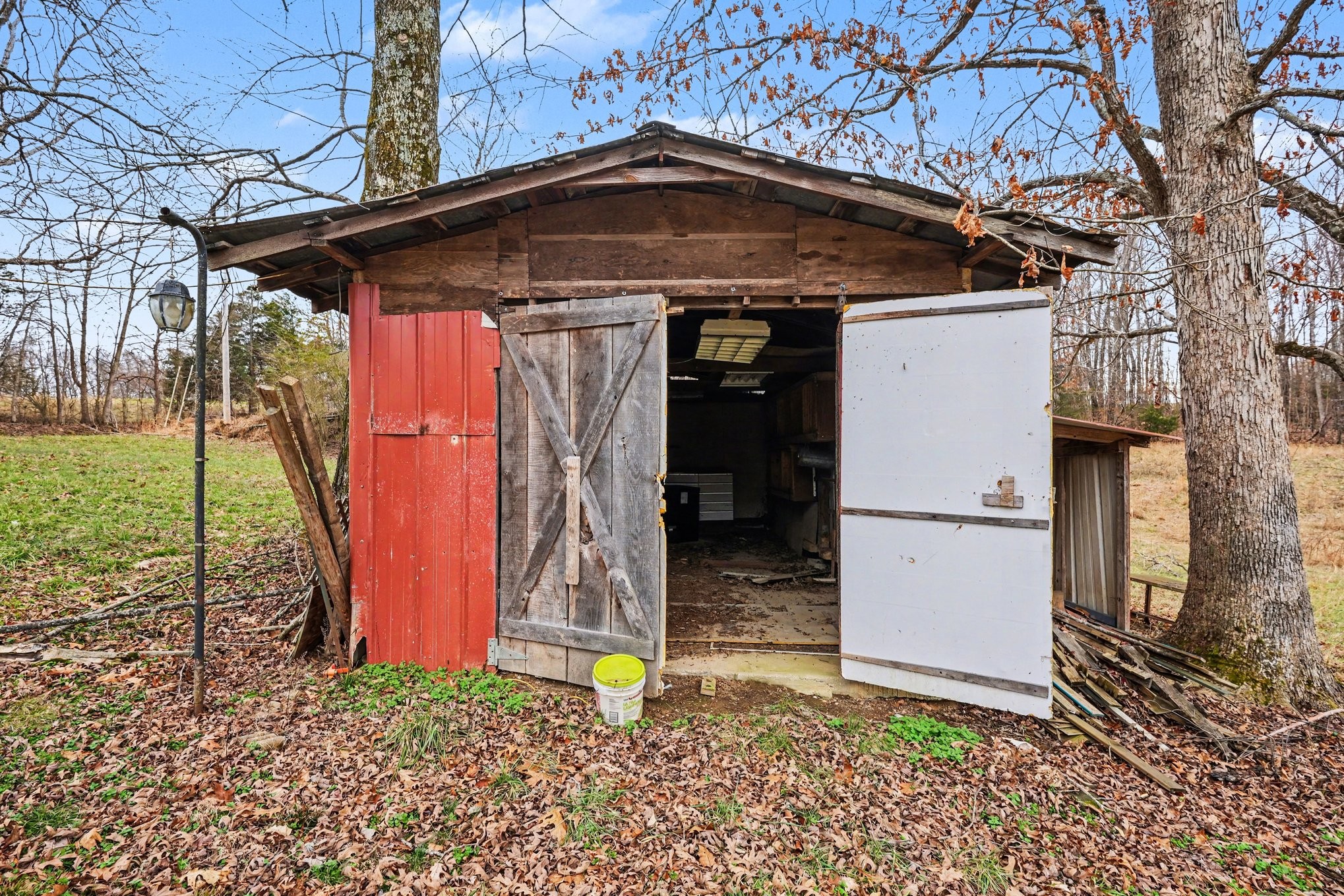 1323 Old Stage Road Charlotte, TN 37036 - Photo 21 of 25 a backyard of a house with lots of green space