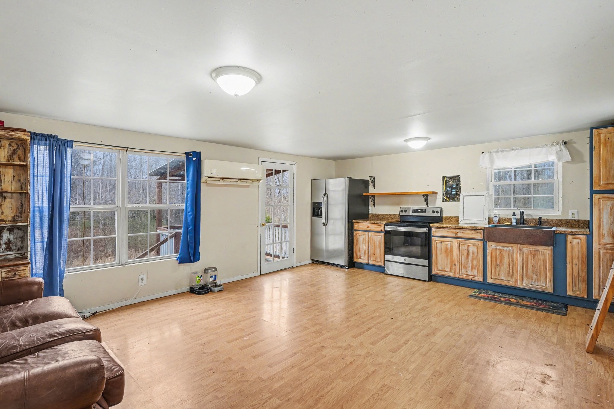 1323 Old Stage Road Charlotte, TN 37036 - Photo 4 of 25 a living room with stainless steel appliances kitchen island granite countertop a stove a sink and a refrigerator