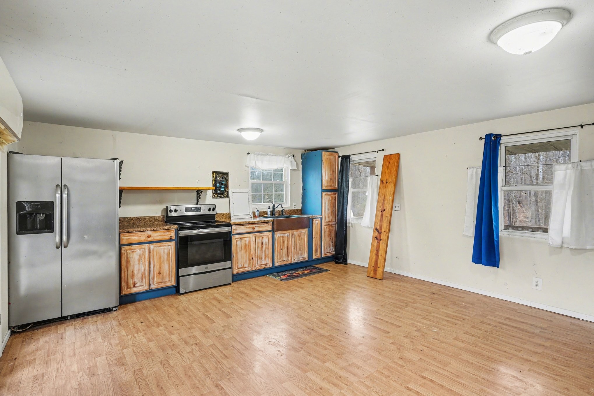 1323 Old Stage Road Charlotte, TN 37036 - Photo 8 of 25 a kitchen with stainless steel appliances a refrigerator and a stove top oven