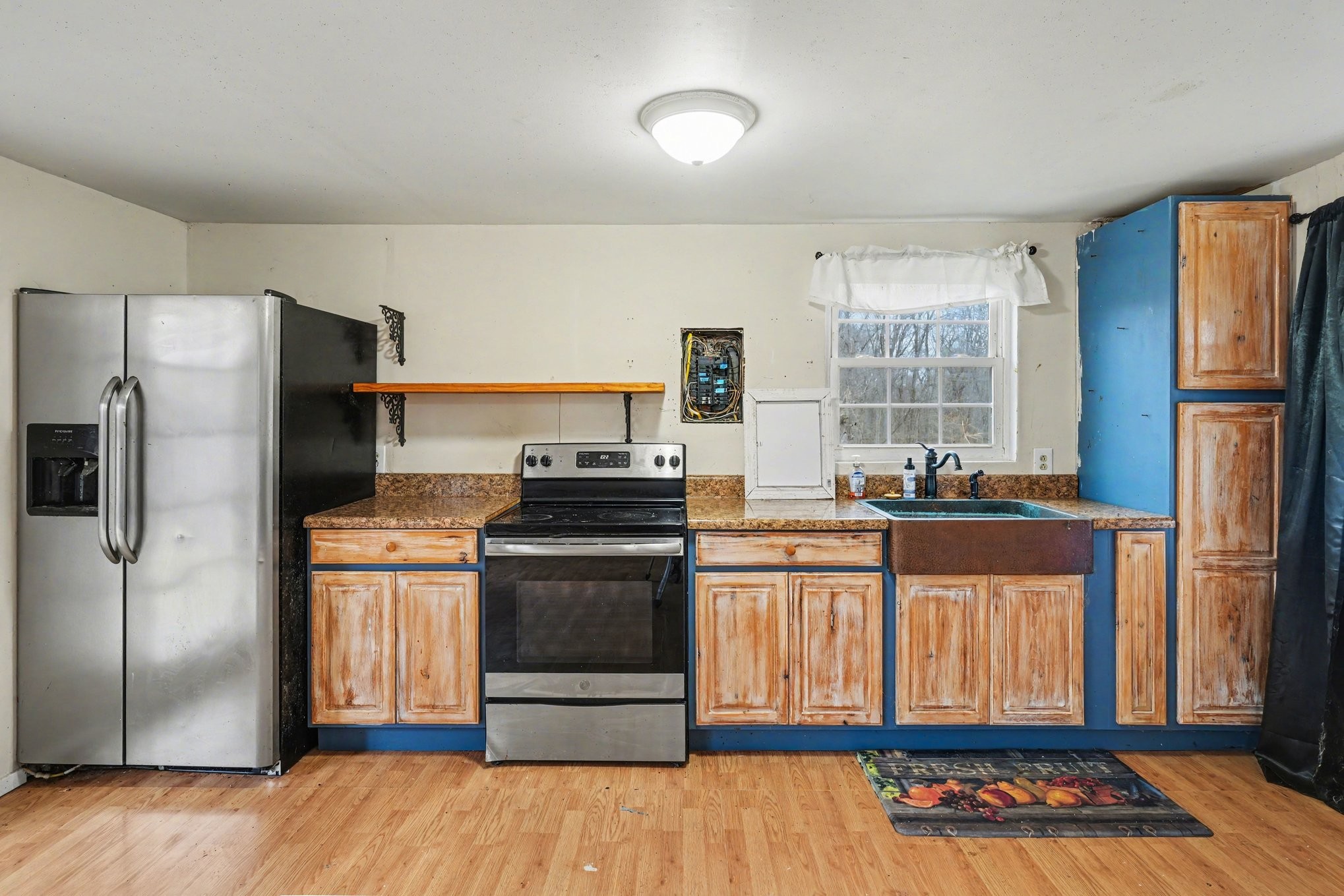 1323 Old Stage Road Charlotte, TN 37036 - Photo 9 of 25 a kitchen with stainless steel appliances granite countertop a refrigerator stove and sink