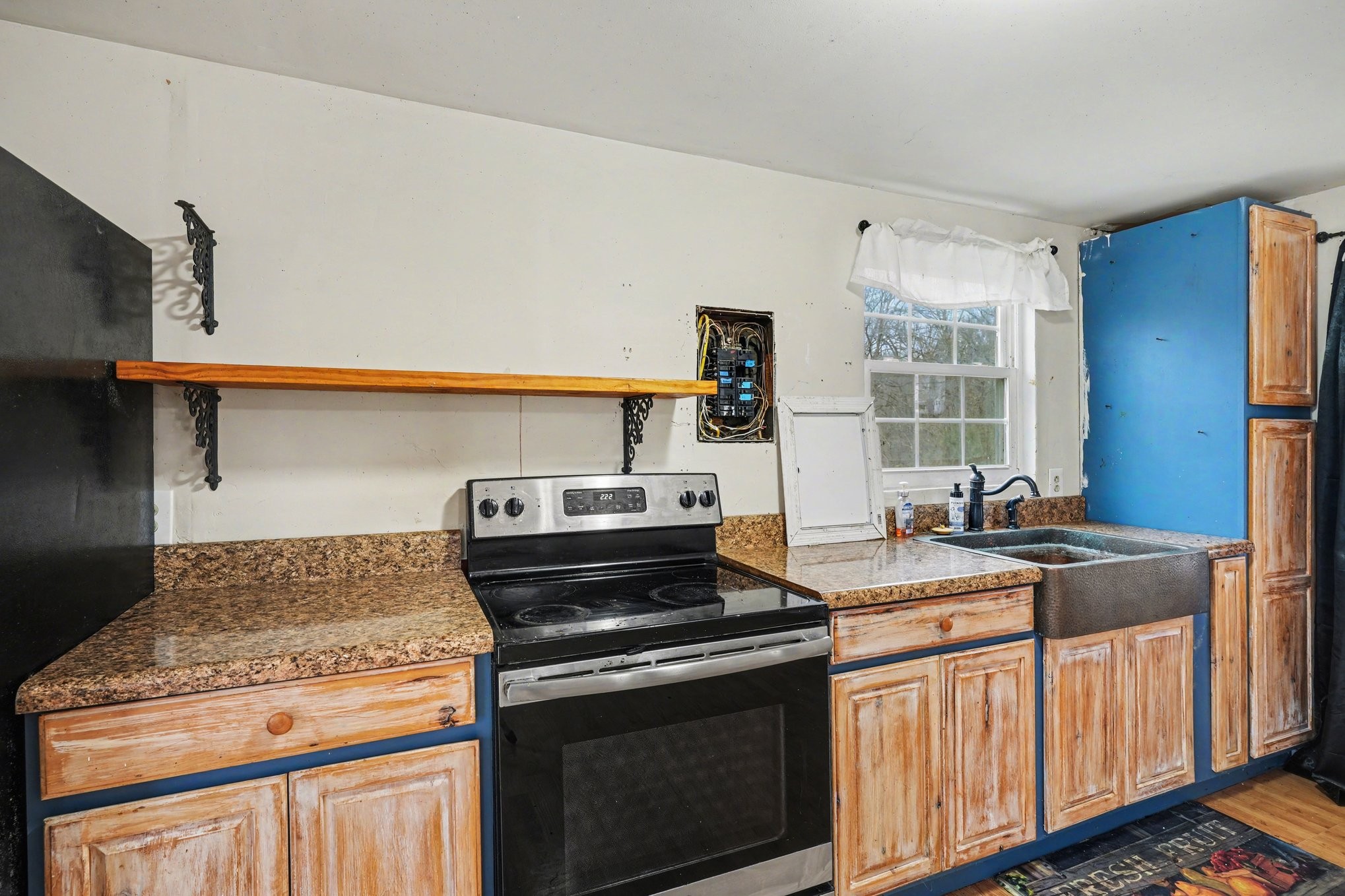 1323 Old Stage Road Charlotte, TN 37036 - Photo 10 of 25 a kitchen with a stove and a sink