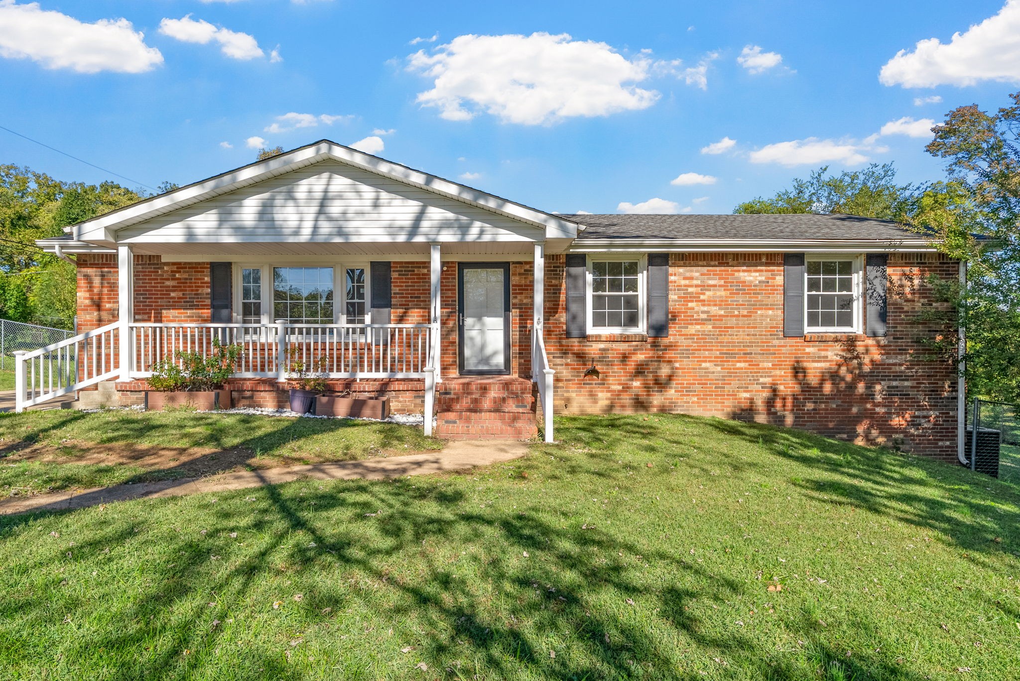 front view of a house with a yard