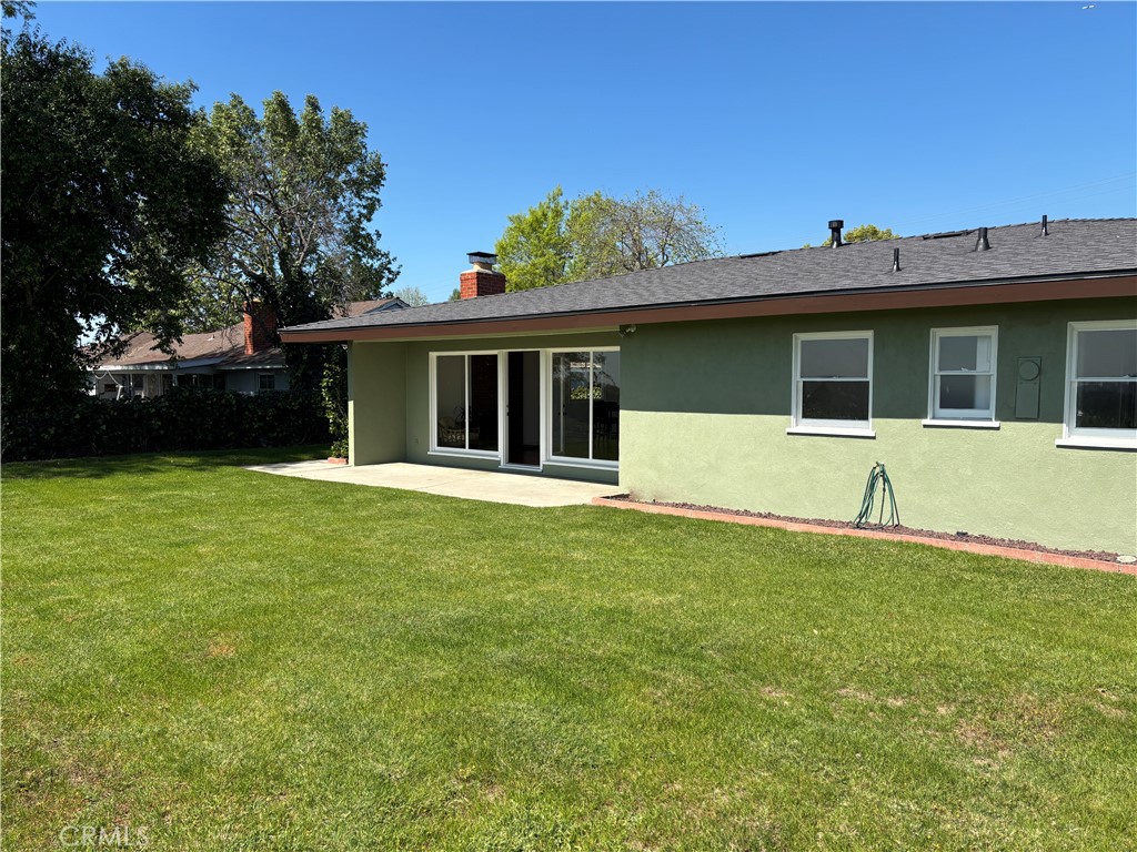 15828 West Road Whittier, CA 90603 - Photo 4 of 20 a house that has a big yard with wooden fence