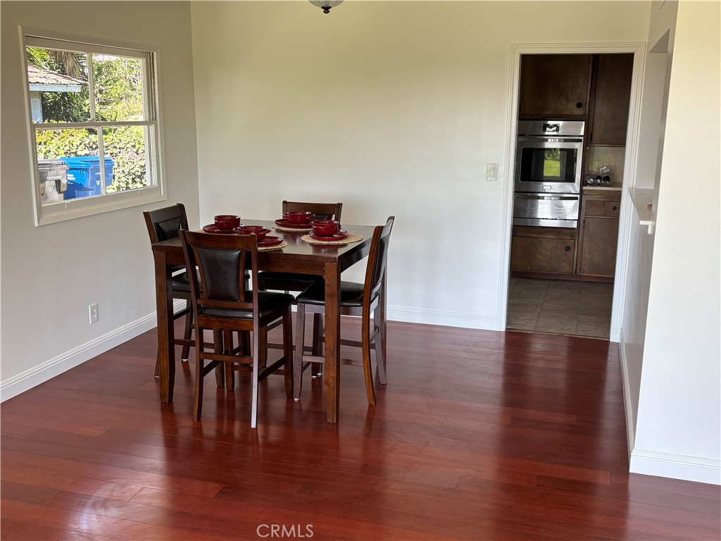15828 West Road Whittier, CA 90603 - Photo 8 of 20 a view of a dining room with furniture and wooden floor