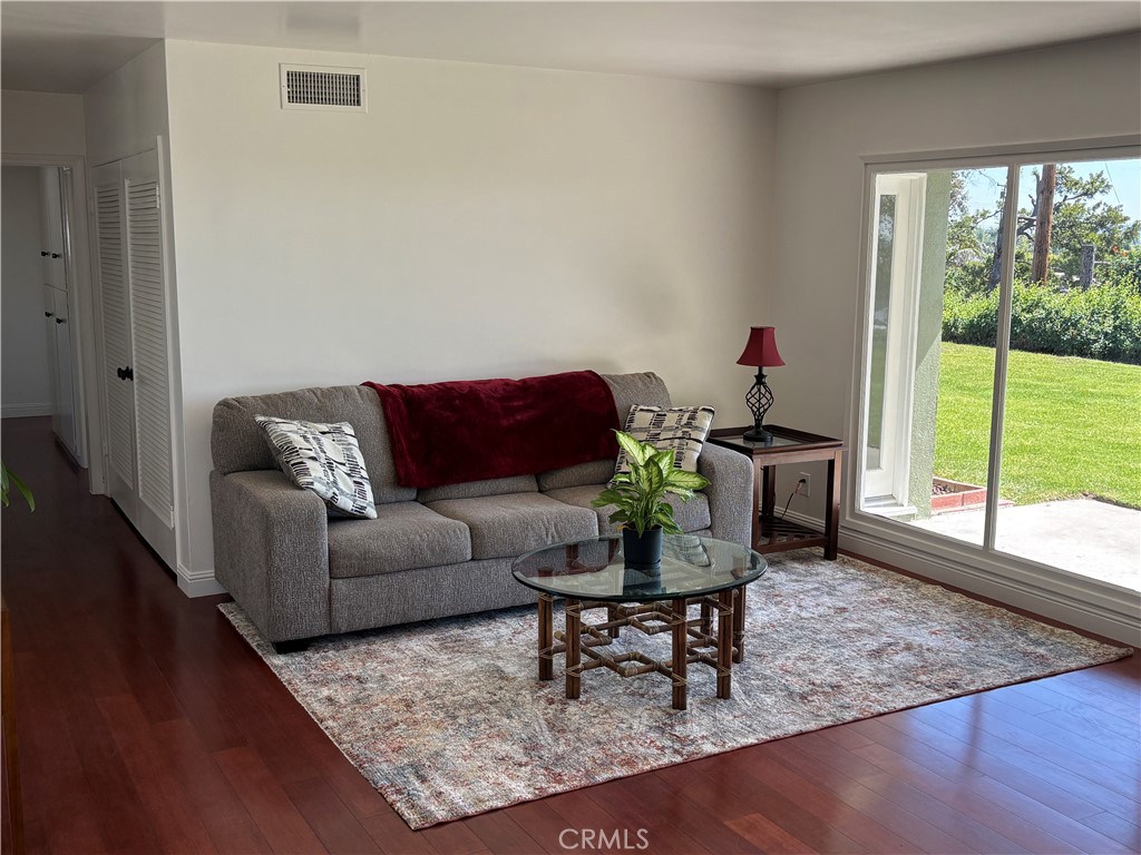 15828 West Road Whittier, CA 90603 - Photo 9 of 20 a living room with furniture and a large window